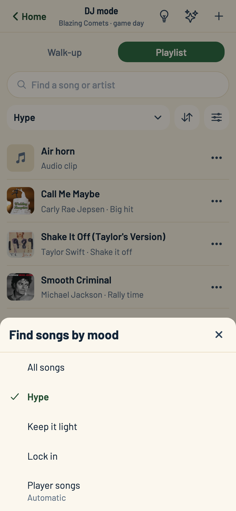 The Playlist screen with the Find songs by mood filter open and Hype selected, with album art visible behind it.